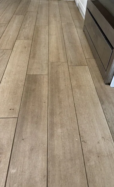 Wood-look floor tiles — before cleaning